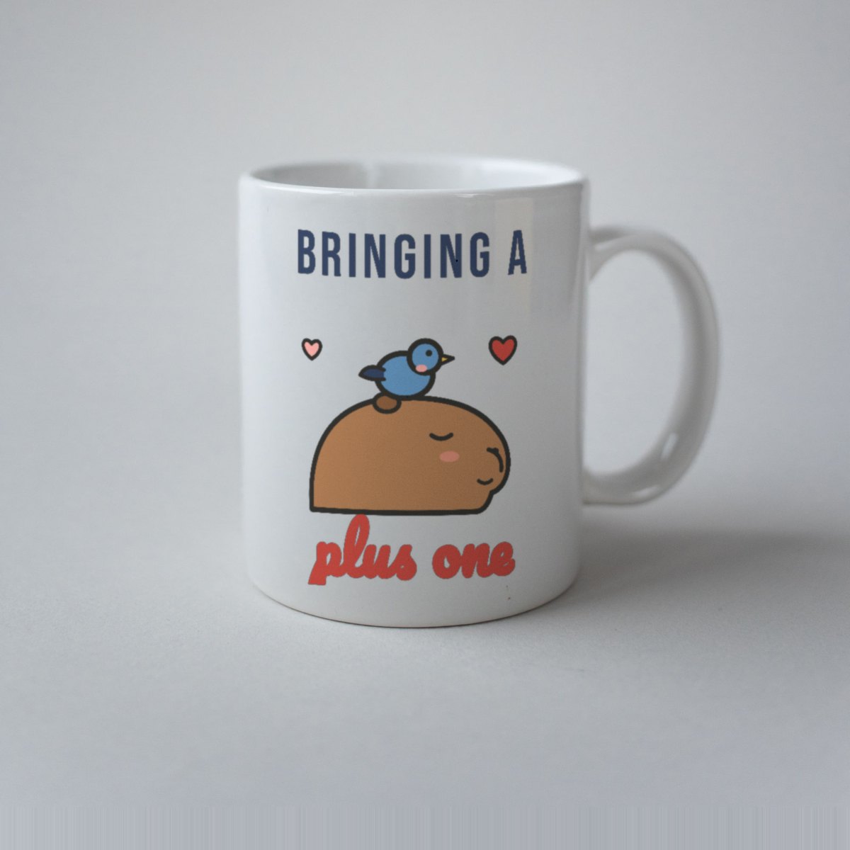 Bringing a Plus One Mug in white