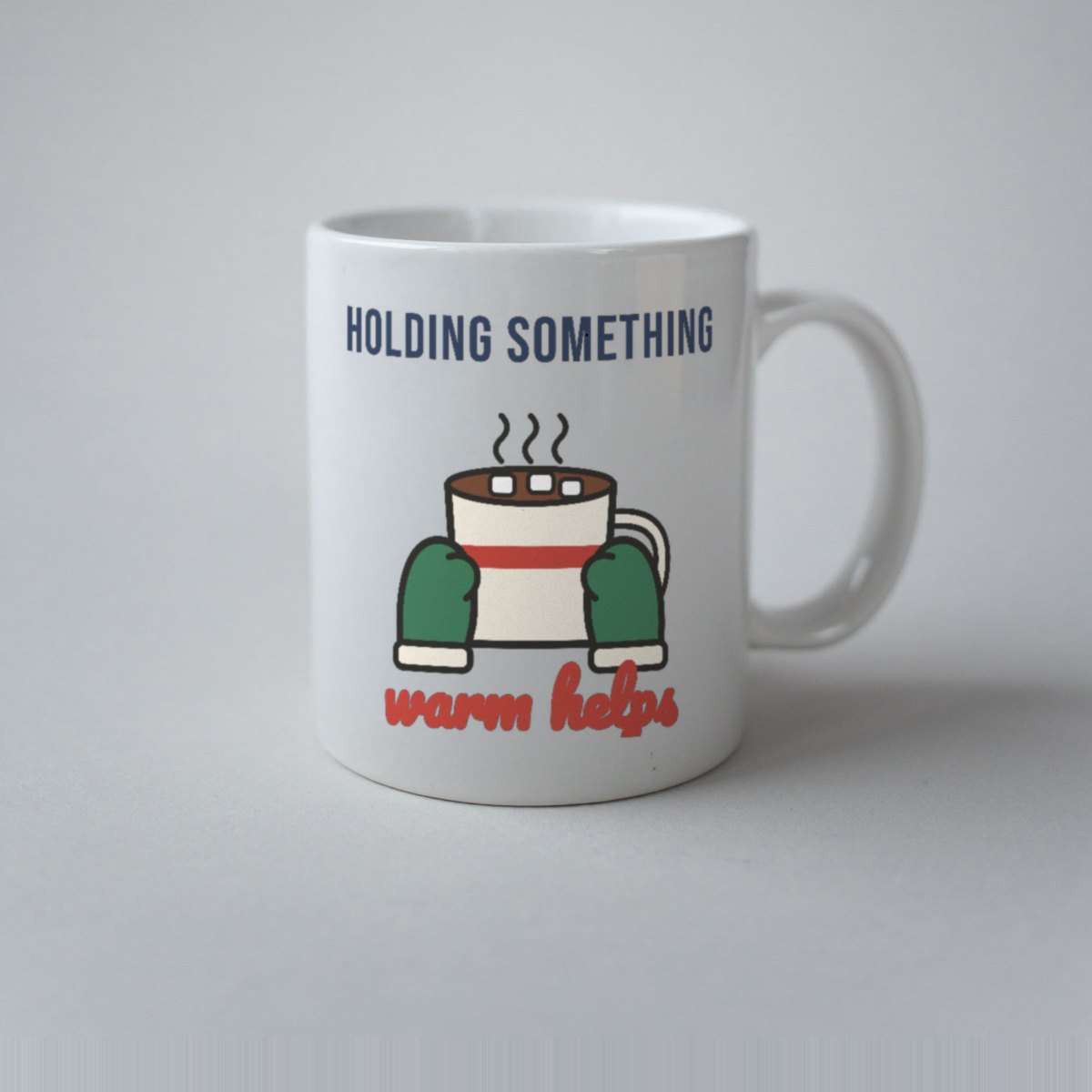 Holding Something Warm Helps Mug in white